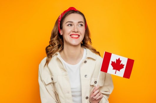 girl-student-smiling-holding-small-canada-flag-isolated-orange-background_101969-1171 girl-student-smiling-holding-small-canada-flag-isolated-orange-background_101969-1171